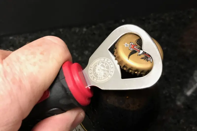 Ergonomic Screwdriver Handle With Integrated Bottle Opener And Bit Storage 1